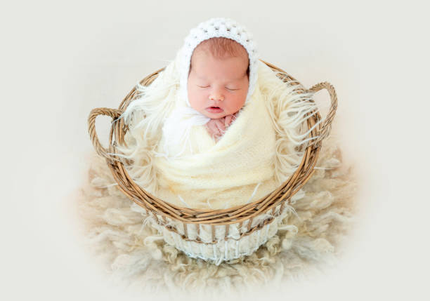 istock newborn baby sleeping in the basket 1404743128
