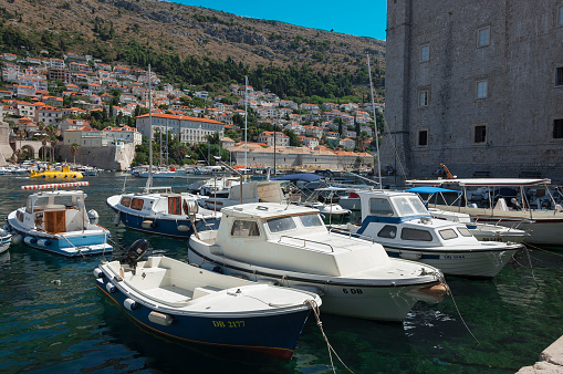 Dubrovnik, Croatia - 17 July 2017: Yachts and boats at pier in the Old port of Dubrovnik. Dubrovnik is the one of the most famous tourists destinations in the Adriatic Sea