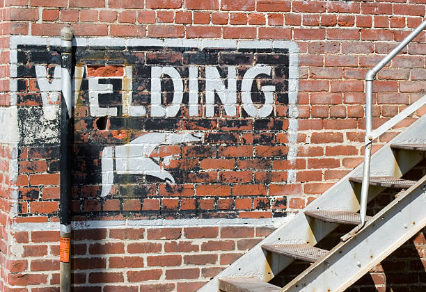 Welding This Way mural painted on wall stock photo