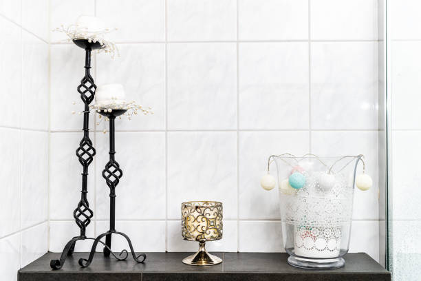 white bathroom tiles tiled wall interior bright natural light design and candle holder object candelabra decorations modern contemporary on shelf table drawer - 16204 imagens e fotografias de stock