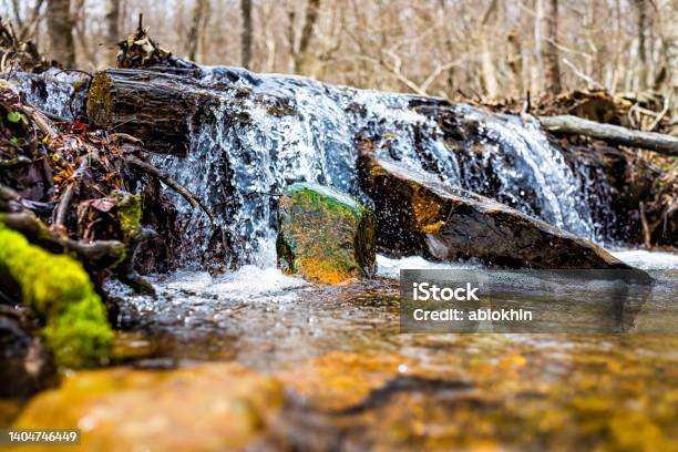 Small Waterfall River Stream Water Flowing In Shamokin Springs Nature Preserve Hiking Trail In Wintergreen Resort In Virginia Closeup Low Angle Ground Level View Stock Photo - Download Image Now