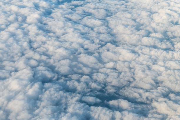 flying above united kingdom scotland with cloudscape aerial high angle view above of abstract dark cloudy landscape sky pattern of white clouds from airplane - 16207 imagens e fotografias de stock