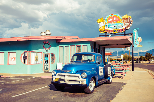 Barstow, California, United States - August 31, 2023: Route 66 pedestal in Main Street in Barstow, which is part of the old Route 66, has several pedestals with vintage cars on top. This one represent the state of Illinois.