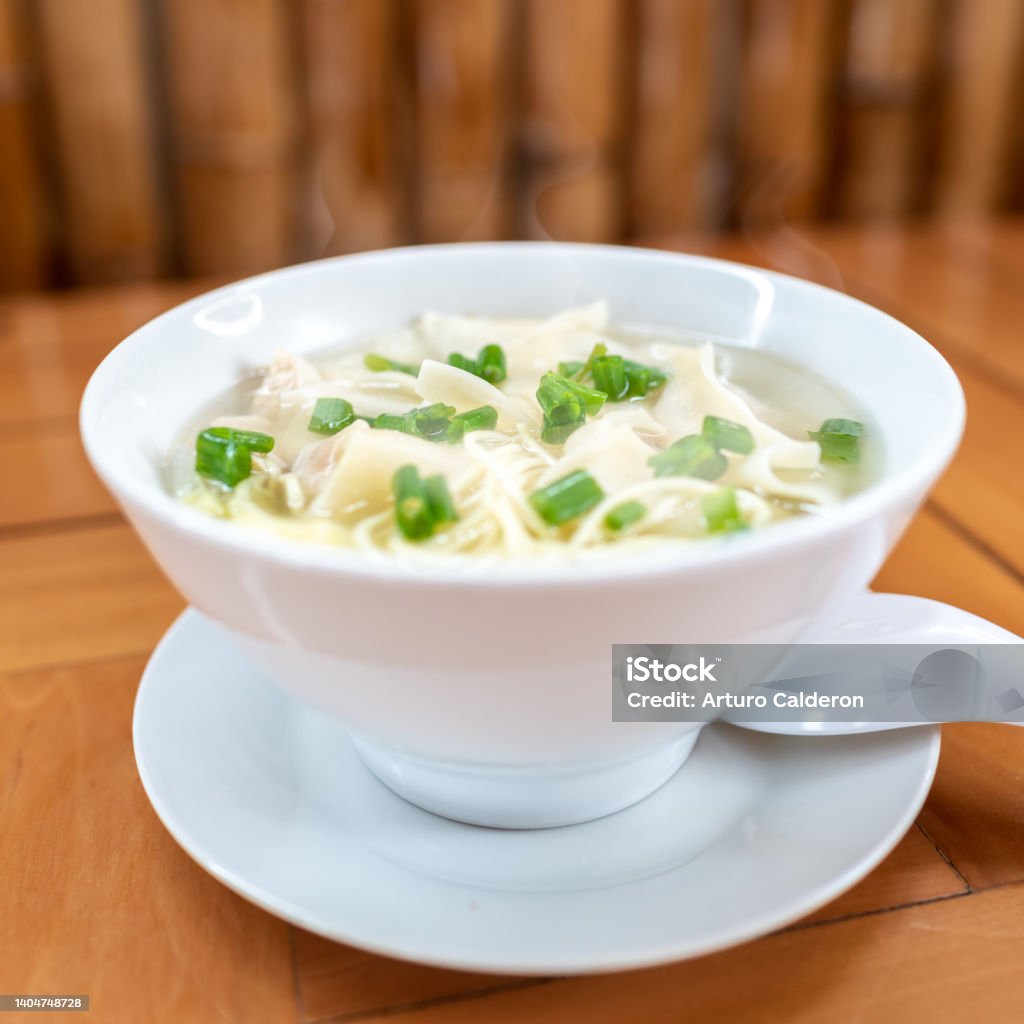 Wuantan soup with chicken noodles and Chinese onion. Chifa. Peruvian food oriental fusion Appetizer Stock Photo