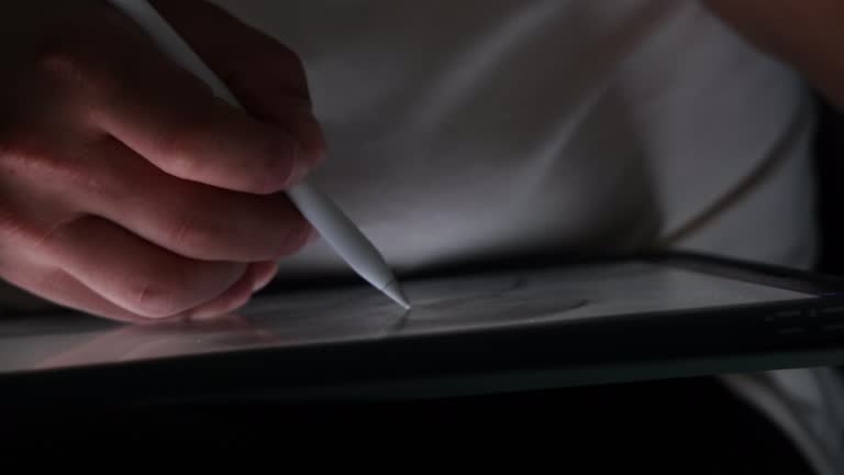 Electronics pen writing on digital tablet screen