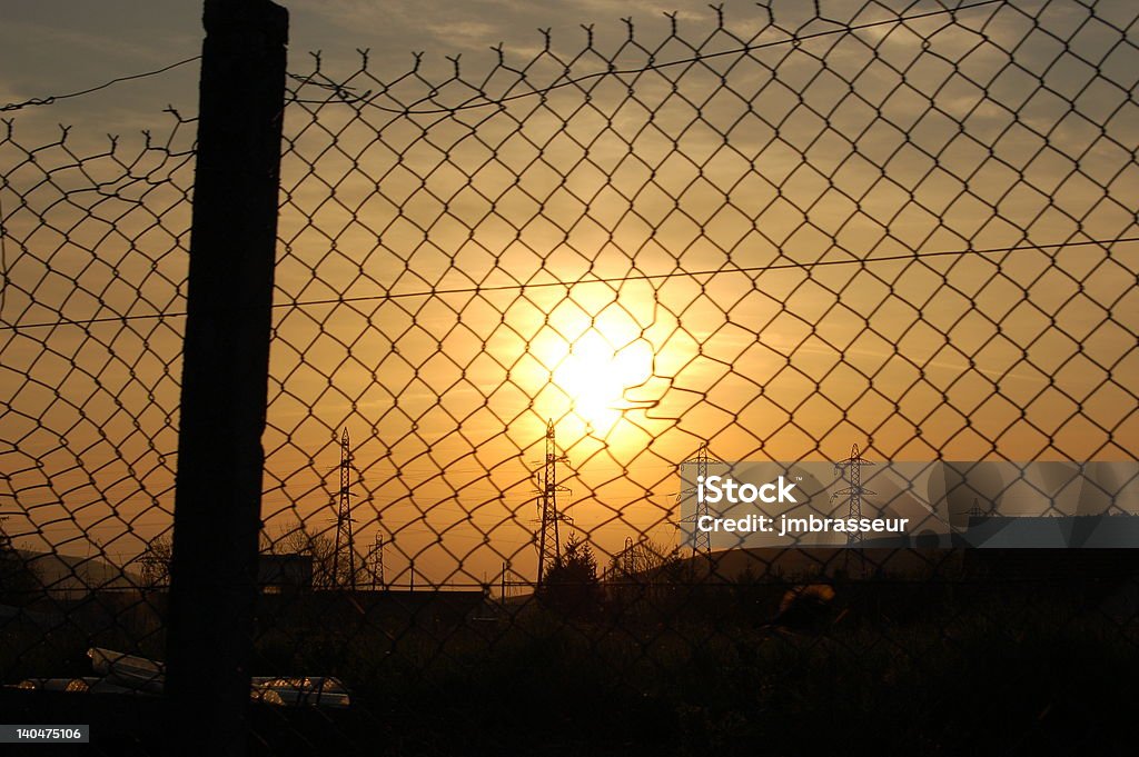 Coucher de soleil sur la cloture - Стоковые фото Бег по природному рельефу роялти-фри