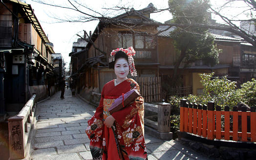 Lady dressed in traditional kimono (Maiko style) in the Gion District of Kyoto, Japan