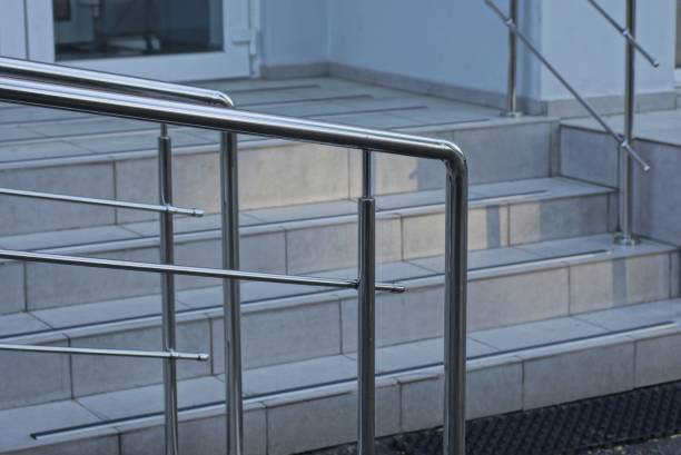 istock gray stone steps and a threshold with white metal handrails 1404752729
