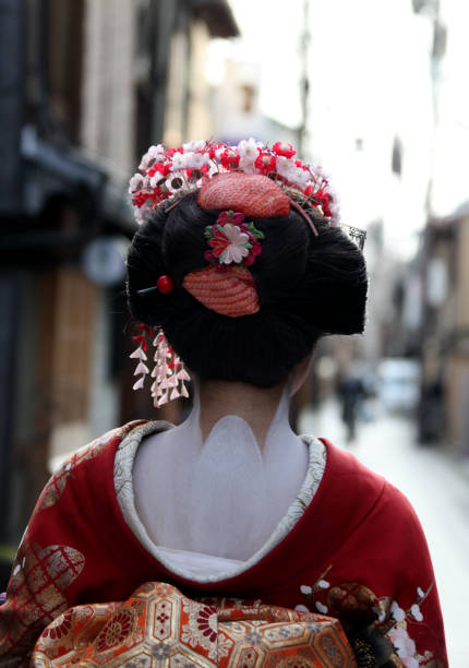 Lady dressed in traditional kimono (Maiko style) in the Gion District of Kyoto, Japan