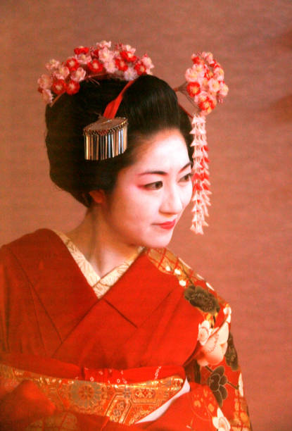 Lady dressed in traditional kimono (Maiko style) in the Gion District of Kyoto, Japan