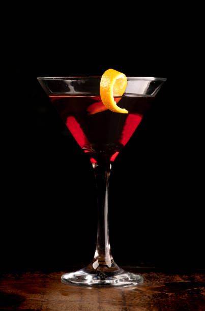 istock front view martini glass with orange slice and cherry drink on dark background on wooden table 1404755614
