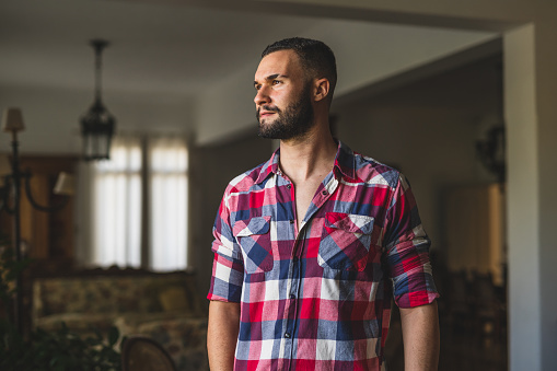 Portrait of a young farmer at home