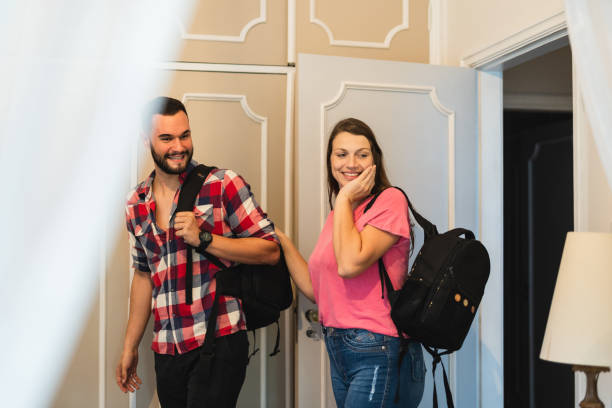 istock Couple arriving at hotel room 1404756511
