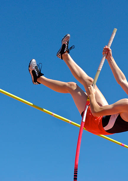 istock Athlete's legs jumping through the air and over mark 140475671
