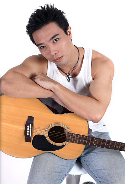 young man with acoustic guitar stock photo