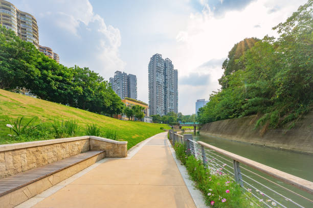 istock Sunny trees, rivers and modern buildings 1404757790