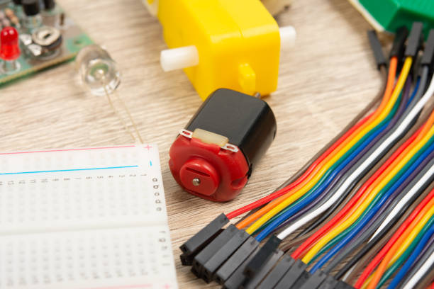 istock Small dc motor and an electronic board that can be programmed. Laboratory in the school. Microcontroller boards for stem education. 1404762375