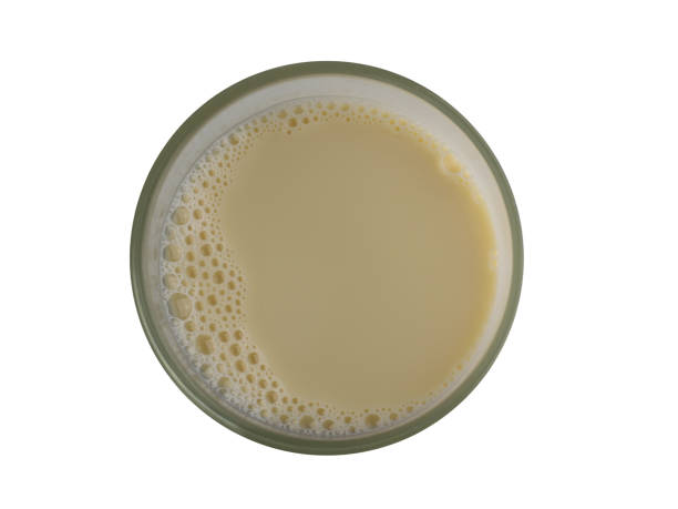 istock soy milk bubble foam top view isolated on white background. 1404764990
