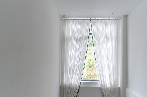 A White Tulle curtain for a transparent window