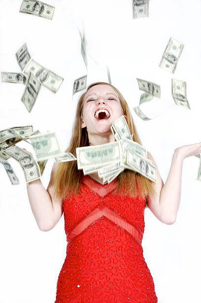 ho vinto il jackpot! - laughing women us paper currency isolated foto e immagini stock