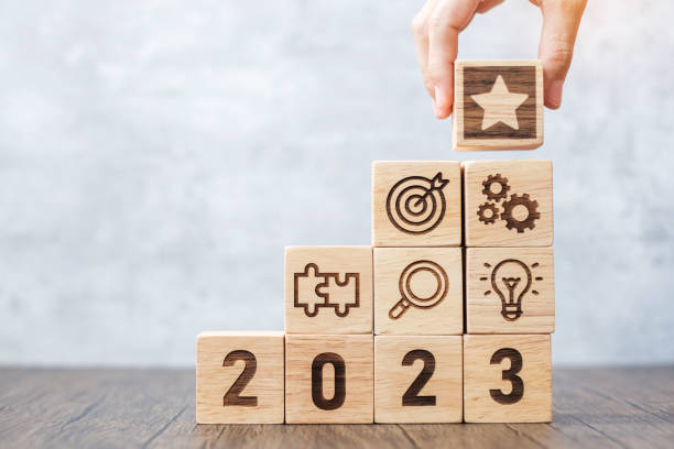 istock 2023 wood block with business success, goal, strategy, target, mission, action, objective, teamwork, plan, idea and New Year start concept 1404770495