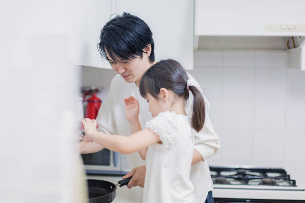 istock A little girl cooking with her daddy 1404770499