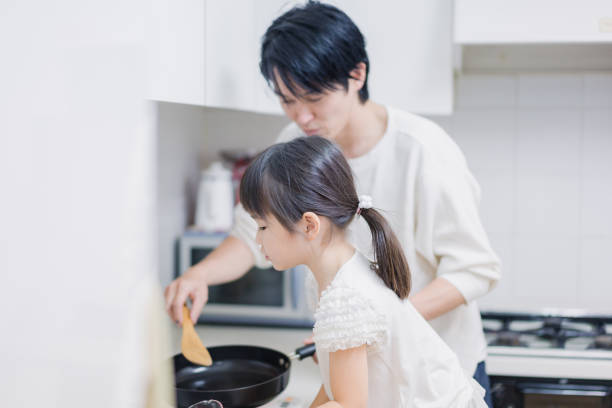 istock A little girl cooking with her daddy 1404770500