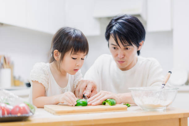 istock A little girl cooking with her daddy 1404770534