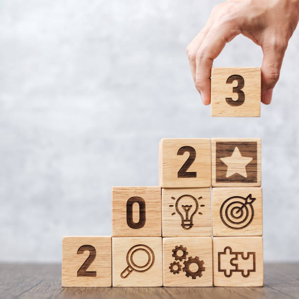 istock 2023 wood block with business success, goal, strategy, target, mission, action, objective, teamwork, plan, idea and New Year start concept 1404770554