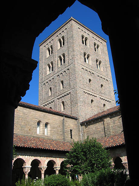 Cloister tower Cloister tower framed by silhouette of hallway arch. cloister stock pictures, royalty-free photos & images