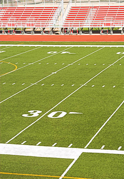 istock Football Stadium with Red Bleachers 140477156
