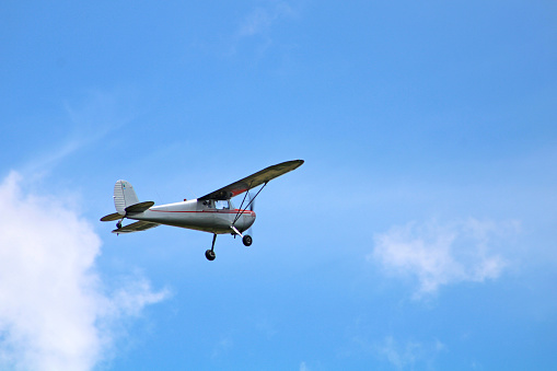 Small Private Airplane in blue sky with clouds near the Fairfield County small airport near Lancaster, Ohio  USA