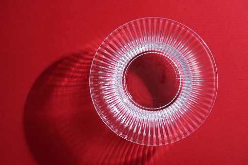 crystal bowl against red background