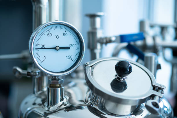 istock Valves and gauges on industrial equipment 1404774628