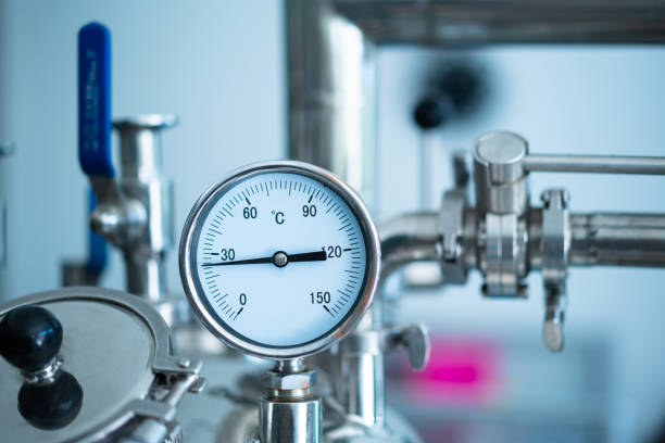 istock Valves and gauges on industrial equipment 1404774635