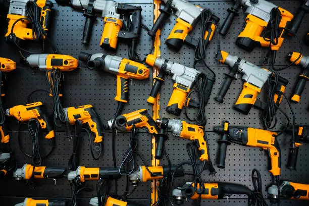 Photo of Many electric drills on the shelf