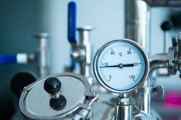 istock Valves and gauges on industrial equipment 1404774642