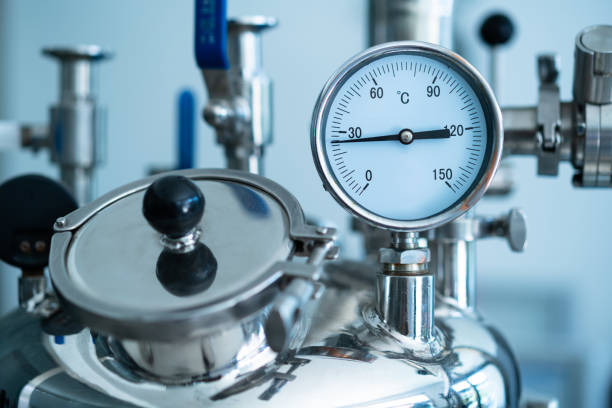 istock Valves and gauges on industrial equipment 1404774698
