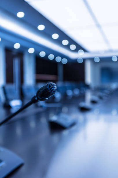istock Defocused effect of luxury interior meeting room with microphone in focus 1404775305