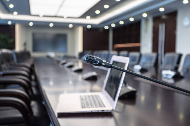 istock Turn on computer and microphone in luxurious interior meeting room, empty meeting room before meeting 1404776346