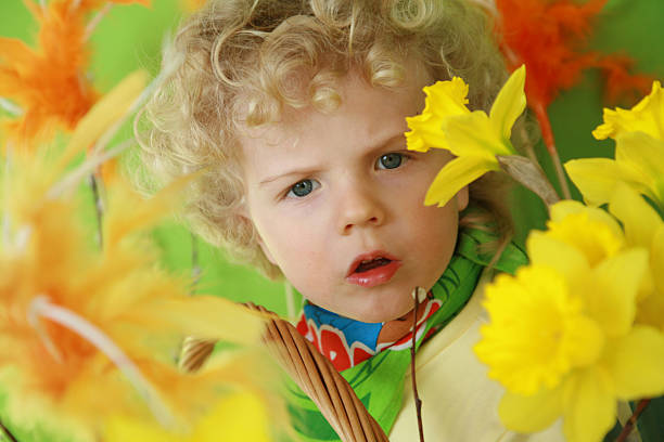 boy with light hair in spring colores stock photo
