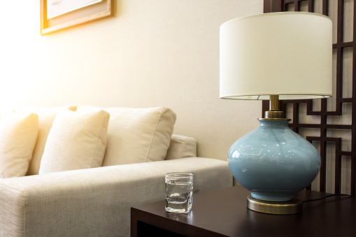 Interior with sofa table lamp and glasses