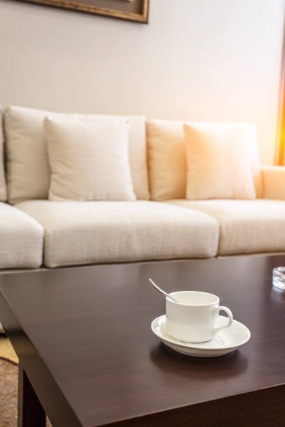 istock Early morning in luxury hotel room with comfortable sofa and coffee 1404787411