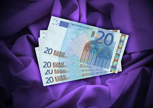 close-up of four 20 Euro banknotes lying on satin background, see also: