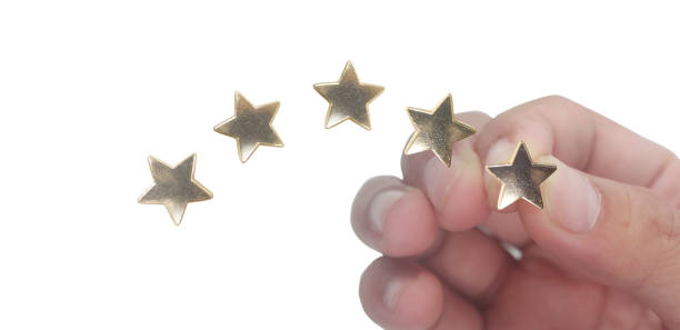 istock Rise on increasing five stars in human hand 1404790027