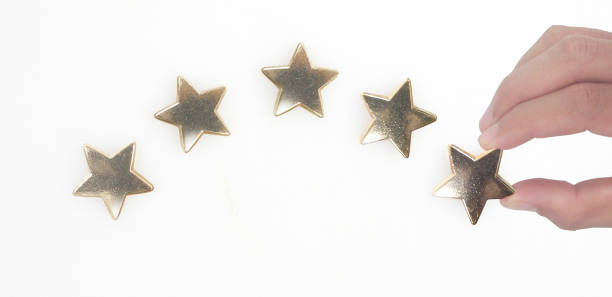 istock Rise on increasing five stars in human hand 1404790031