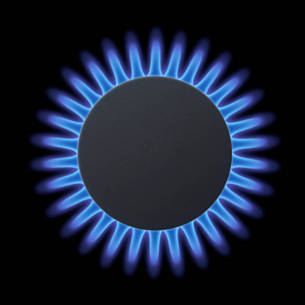 Blue flames of gas stove stock photo