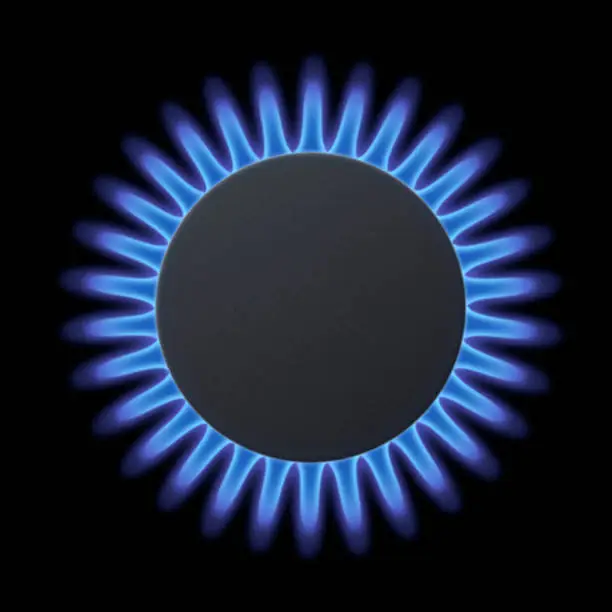 Gas burners with blue flame on black background.