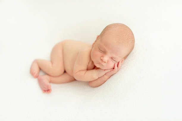 istock Dreamy newborn baby sleeping on bed 1404791382