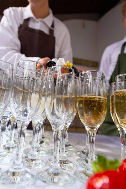 istock A banquet table with wine glasses and plates with strawberries. 1404791643